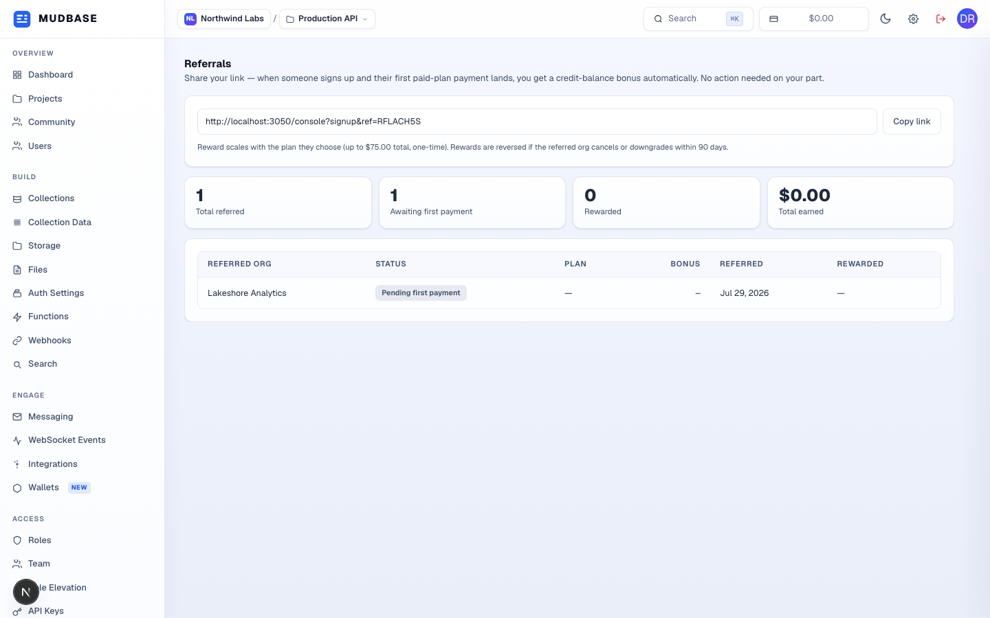Referrals page with the referral link and Copy link button, the stat cards, and the referrals table showing one pending referral